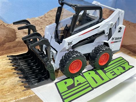 toy ride on skid steer|toy track loader.